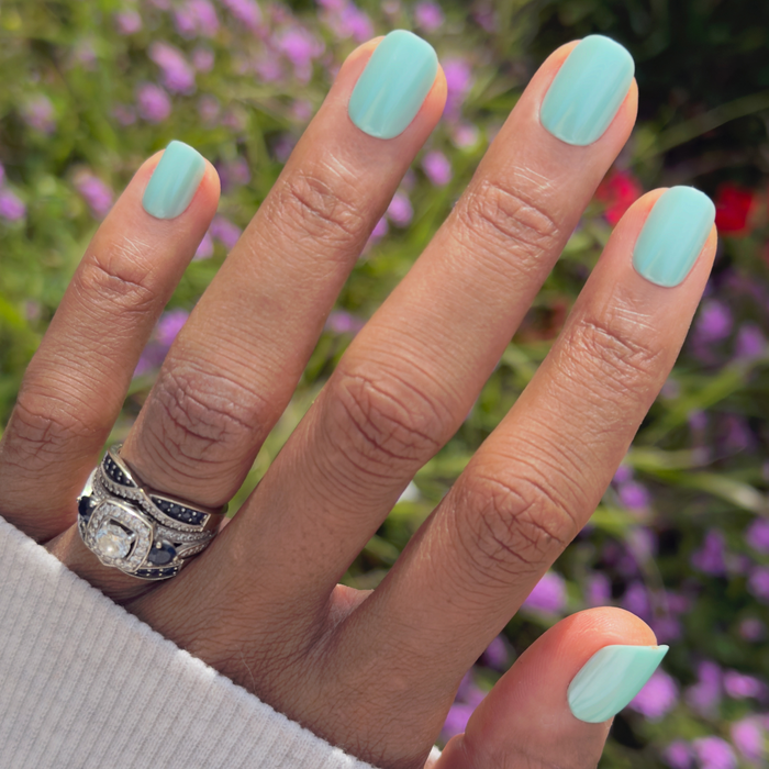Slam Dunk Chrome - Press-On | Extra Short | Squoval turquoise press-on nails on hand outdoors with natural light