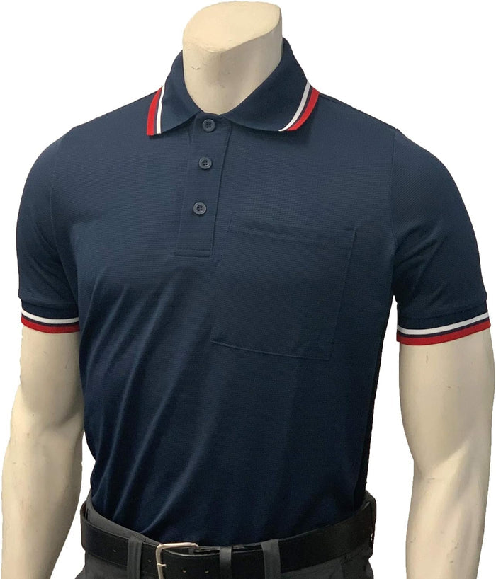 A mannequin wears the Smitty Pro Flex Umpire Polo Shirt (BB-S307) by Smitty—dark blue, short-sleeve with a front pocket, white and red striped collar and cuffs, professional fit, tucked into dark pants with a black belt.