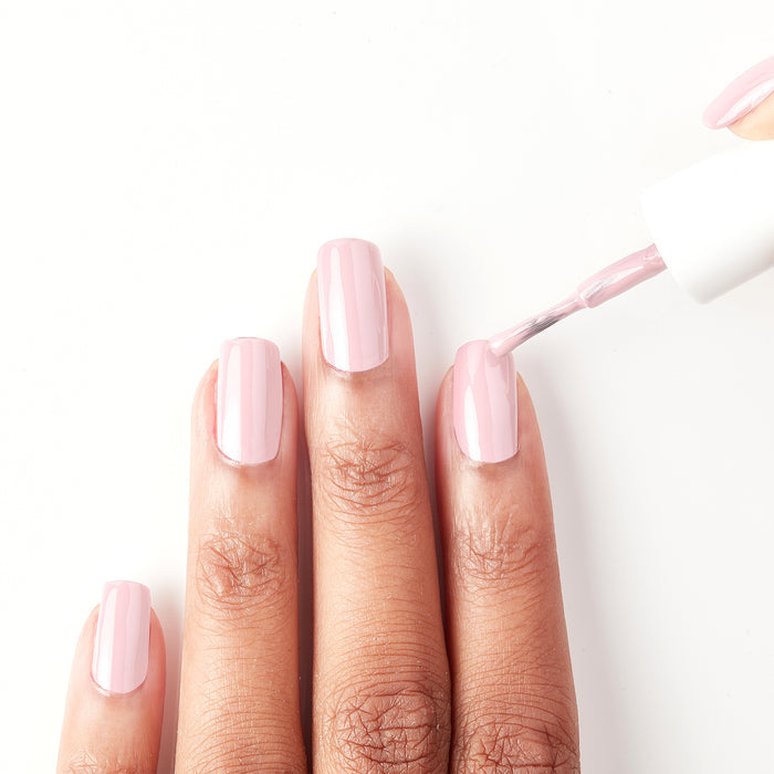 Applying So in Love pastel pink nail polish