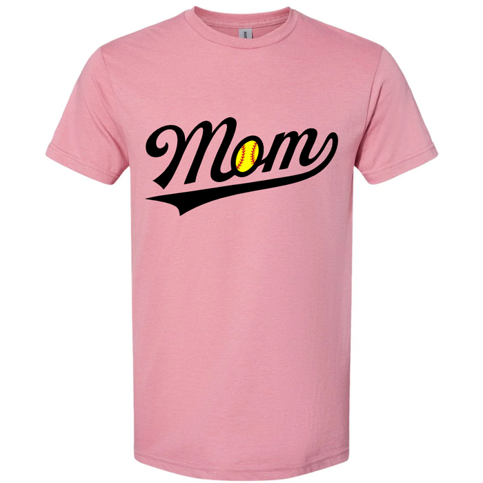 The DSG Apparel Softball Mom Softstyle Short Sleeve Shirt in Plumrose features "Mom" in black script with a yellow softball for the "o"—a cute, stylish choice for softball fans who love comfortable Gildan cotton tees.