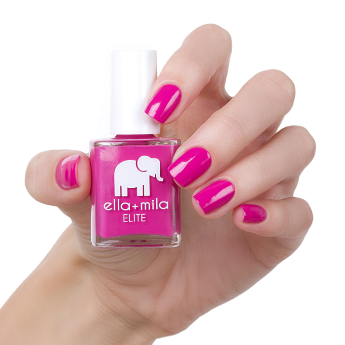Summer Roam-ance berry pink nail polish manicure on a light skin tone with the bottle