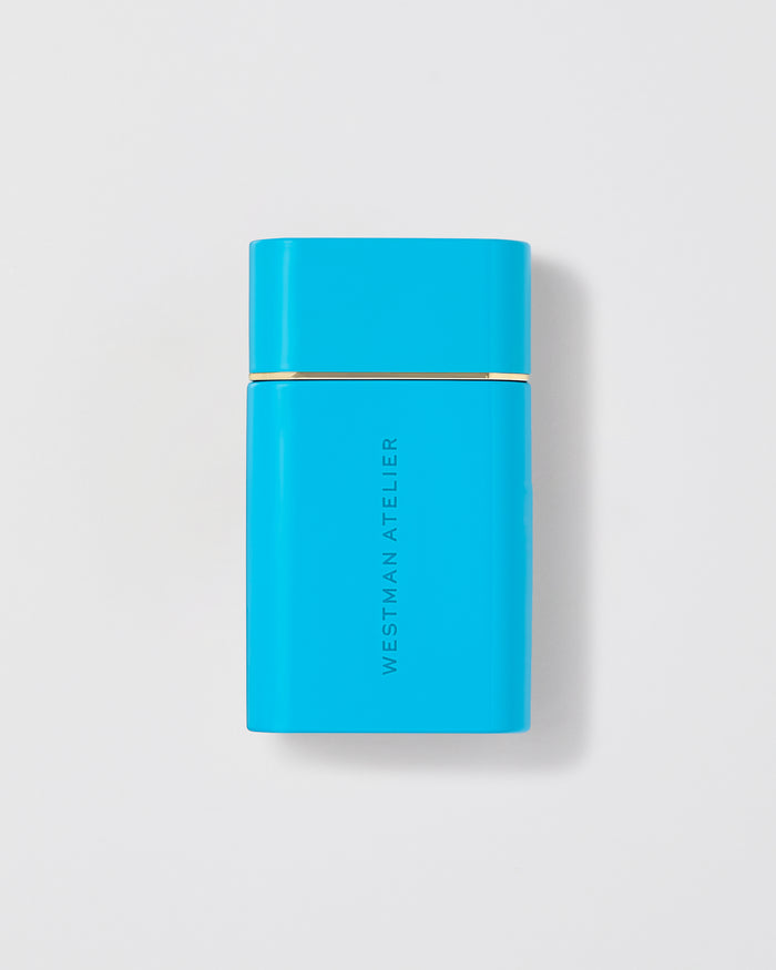 Sun Tone Bronzing Drops in a light blue bottle.