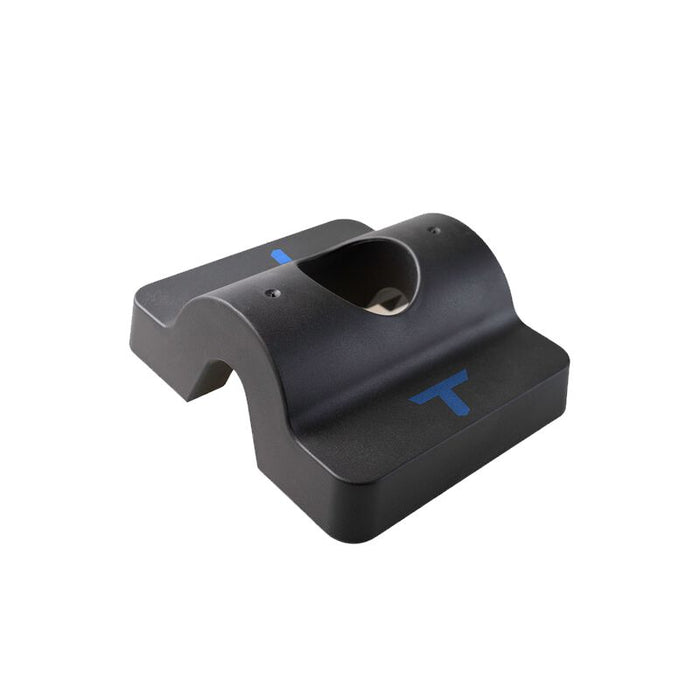 The Tanner Tees T-Weight: TNTW by Tanner is a black plastic accessory featuring a curved top, central cutout, and blue T-shaped markings on the front and side. Designed as a baseball practice aid, it functions as a support or holder to enhance batting tee stability during training sessions.