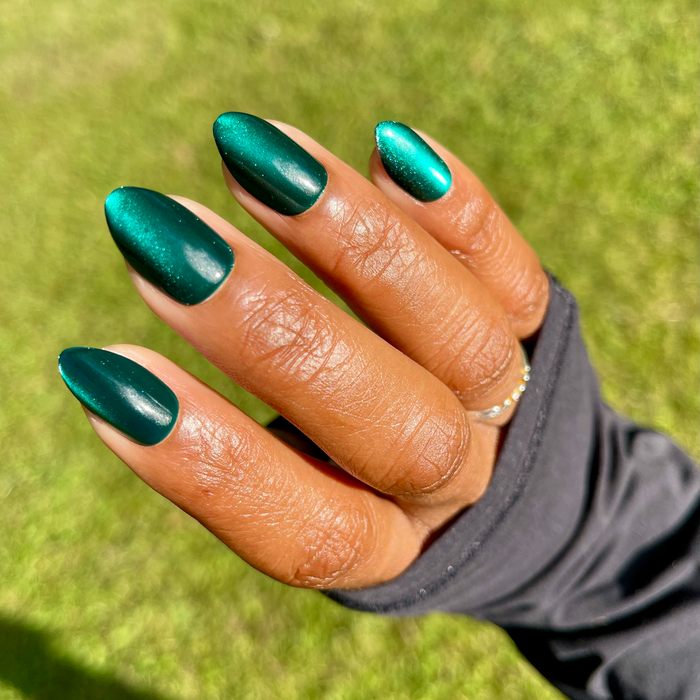 Team Letter - Press-On | Medium | Almond showing nails with shimmering deep emerald green velvet effect manicure by Olive and June