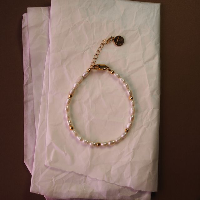 the remi bracelet gold lay on white tissue paper by luna  rose