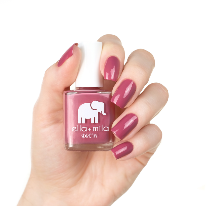 Time for a Bond-fire warm mauve nail polish manicure on a light skin tone with the bottle