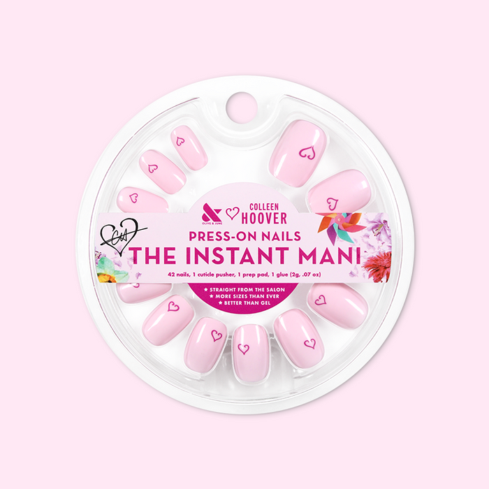 Tiny Heart Tattoo - Press-On | Short | Squoval showing pale pink squoval press-on nails with small heart design in circular packaging
