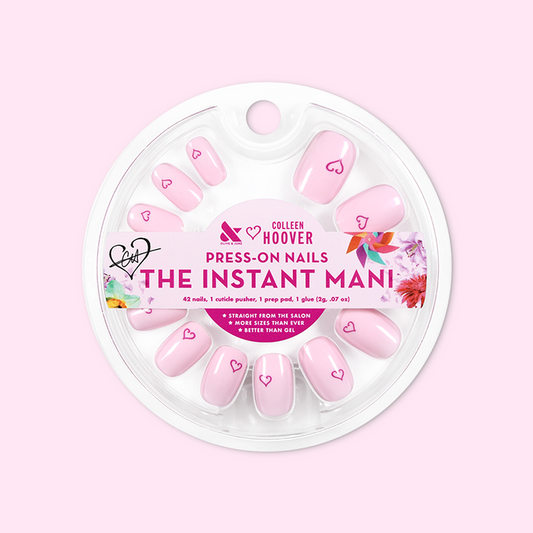 Tiny Heart Tattoo - Press-On | Short | Squoval showing pale pink squoval press-on nails with small heart design in circular packaging