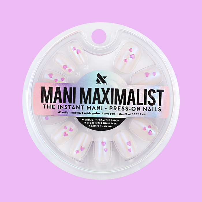 Tiny Puffy Hearts - Press-On | Short | Squoval showing short squoval nails with iridescent base and small puffy pink hearts